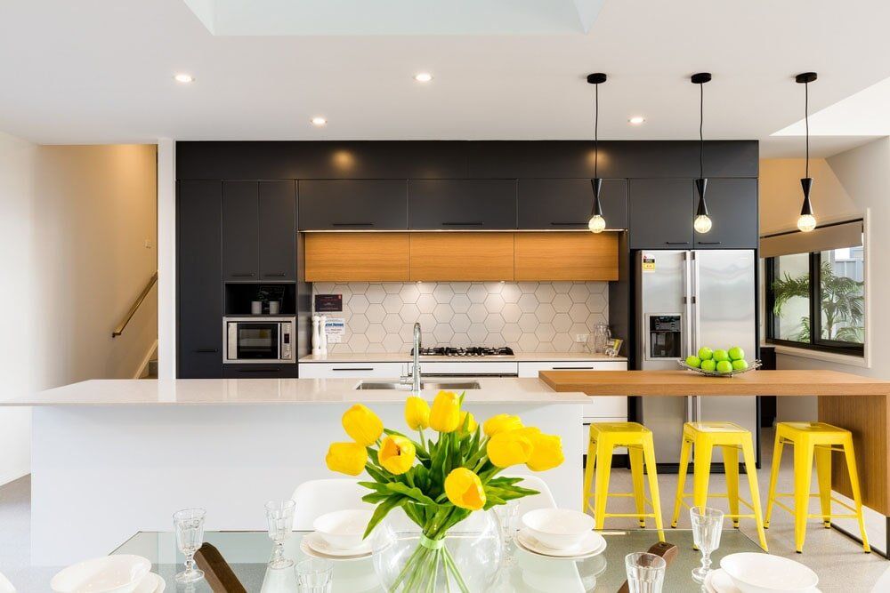Kitchen With Yellow Chair — West Stone Benchtops in Orange, NSW