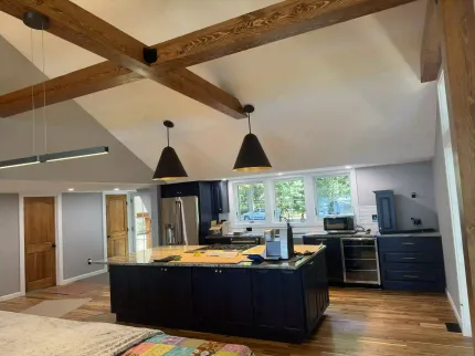 A kitchen with a large island in the middle of the room.