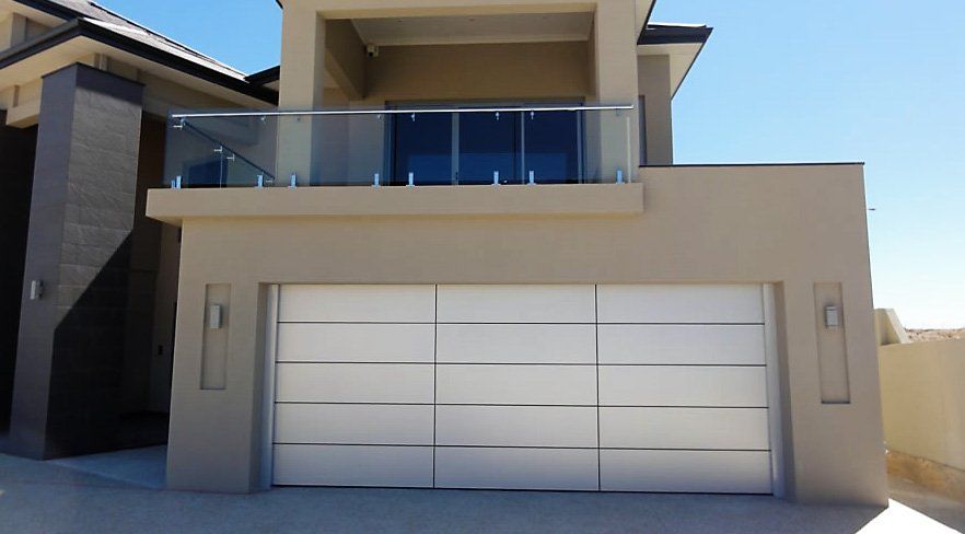 modern garage door on beige house