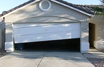 white broken garage door