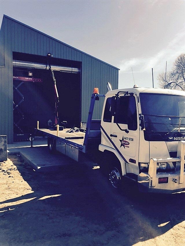 truck installing garage door