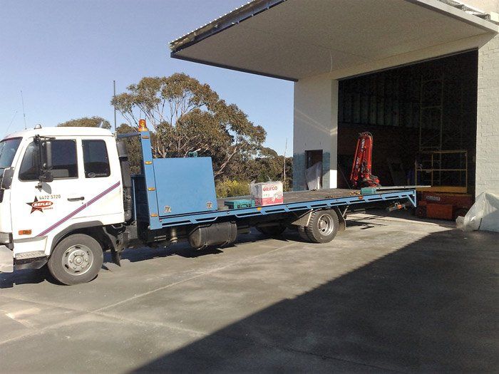 truck delivering garage door