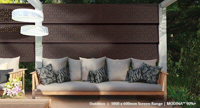 A couch with a lot of pillows on it