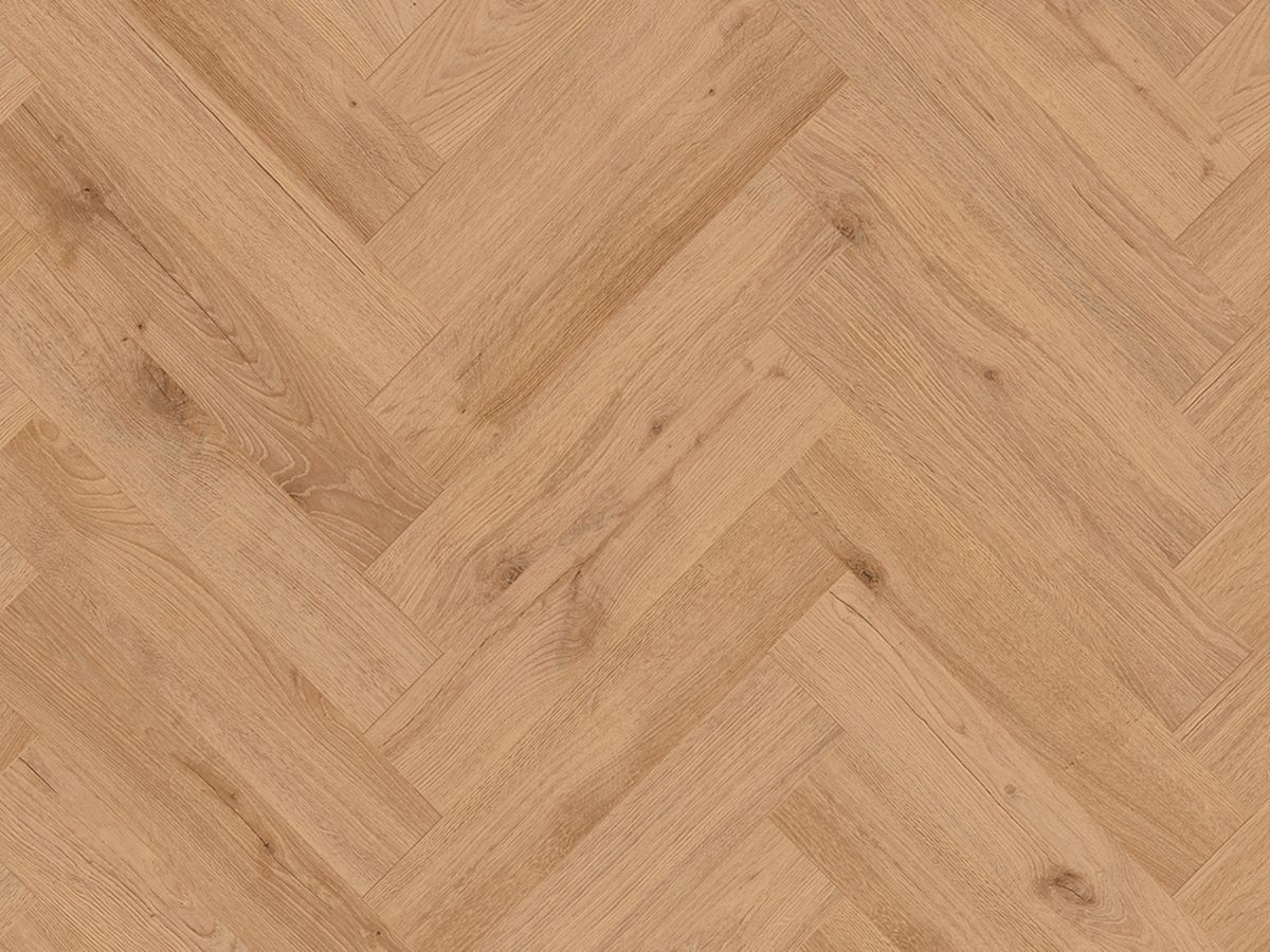 A close up of a wooden floor in a herringbone pattern.