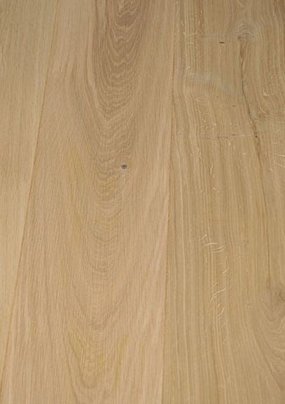 A close up of a piece of wood showing the grain and texture.