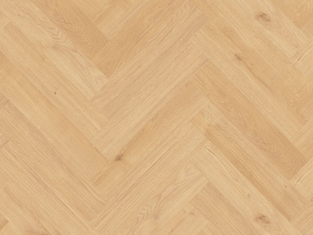 A close up of a wooden floor with a herringbone pattern.