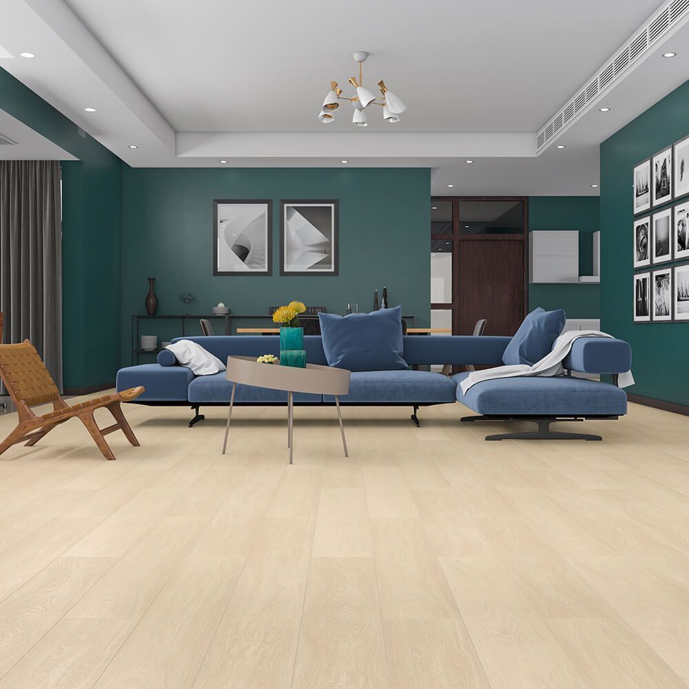 A living room with a blue couch and a chair