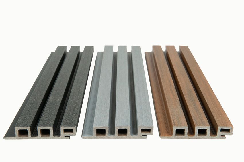A row of wooden slats in different colors on a white background