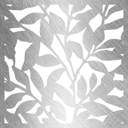 A stencil of a tree with leaves on a metal surface.