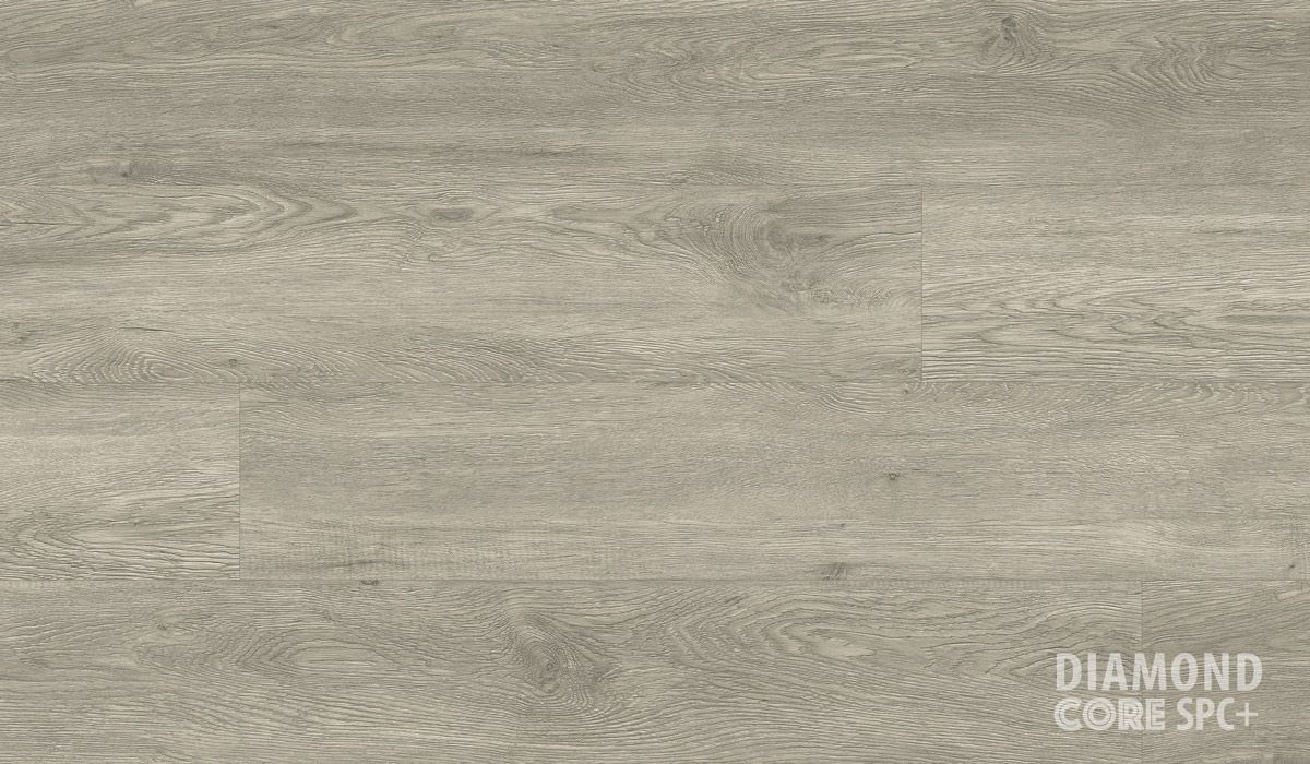 A close up of a wooden floor with the words `` diamond core spc '' written on it.