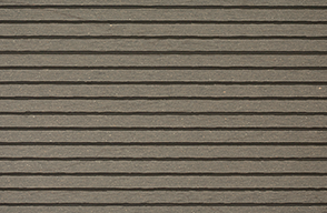 A close up of a gray siding with a striped pattern.