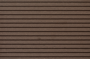 A close up of a brown wooden wall with a striped pattern.