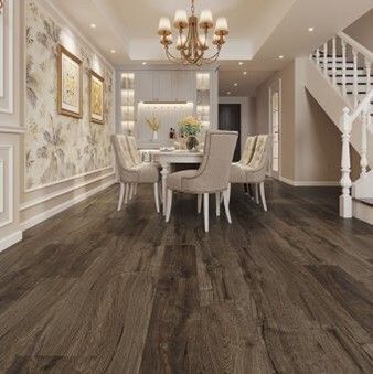 A dining room with a table and chairs and a chandelier.