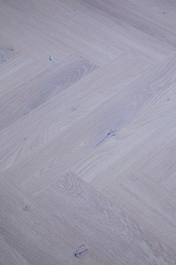 A close up of a white wooden floor.