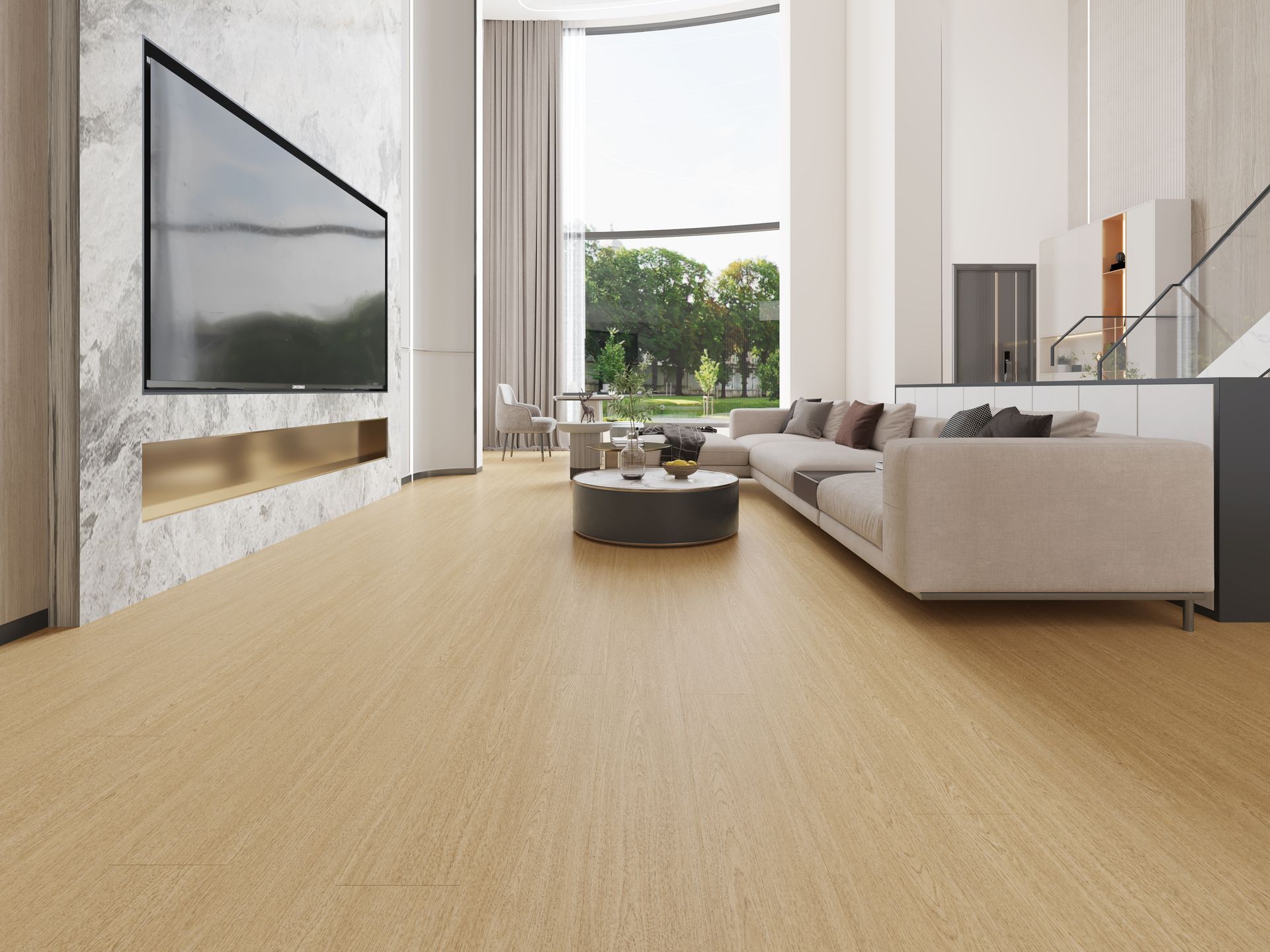 A living room with a couch and a television on the wall.