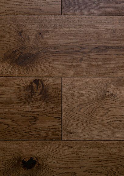 A close up of a wooden floor with a lot of grain.