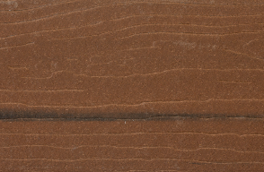 A close up of a piece of brown wood.
