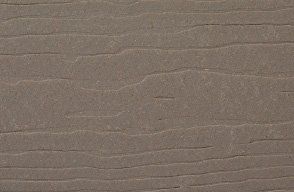 A close up of a piece of cardboard with a wood grain texture.