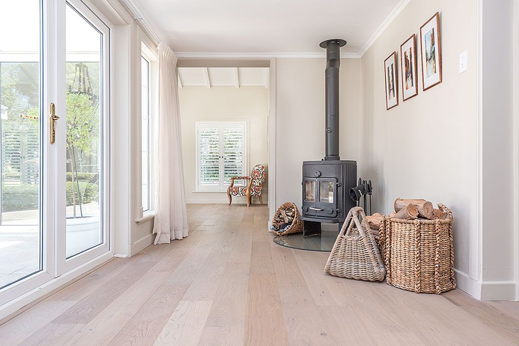 There is a wood stove in the middle of the room.
