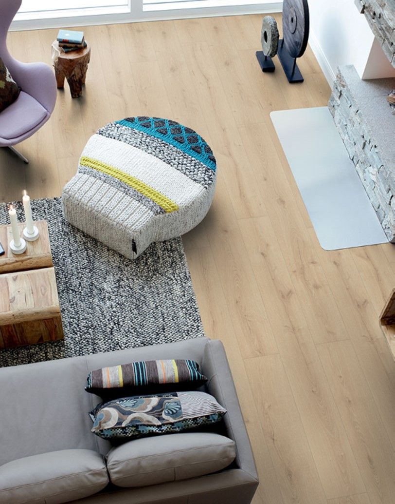 An aerial view of a living room with a couch and chairs