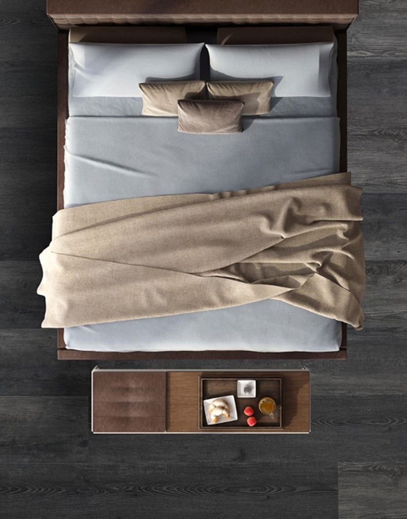 An aerial view of a bed with a tray on the end of it