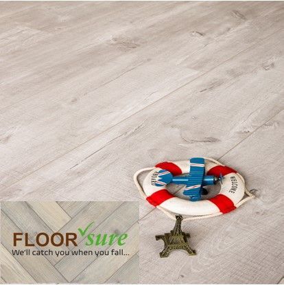 A picture of a life preserver and an airplane on a floor that says floor sure