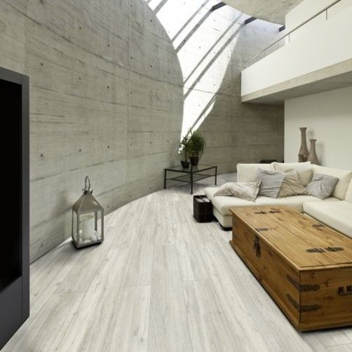 A living room with a couch and a wooden table