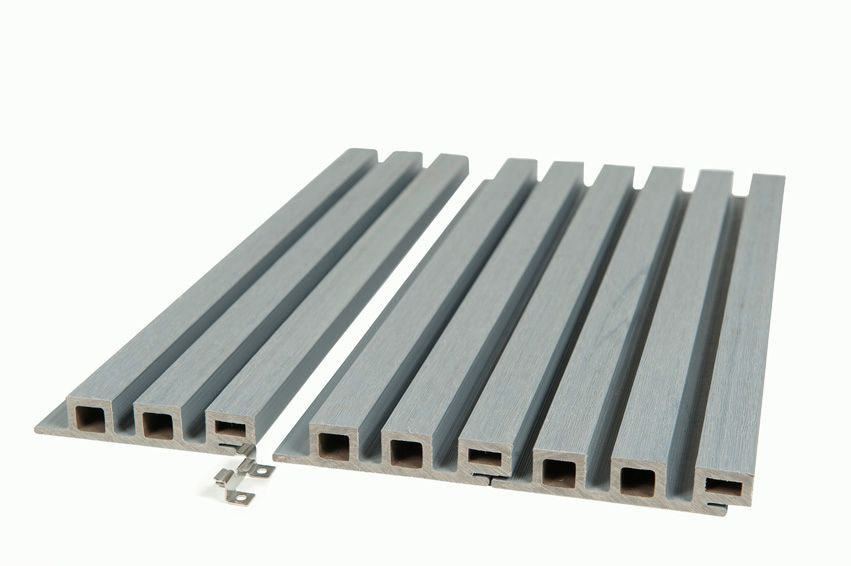 A row of gray slats with screws attached to them