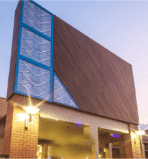 A large building with a blue window on the side