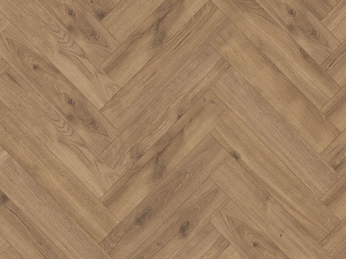 A close up of a wooden floor in a herringbone pattern.