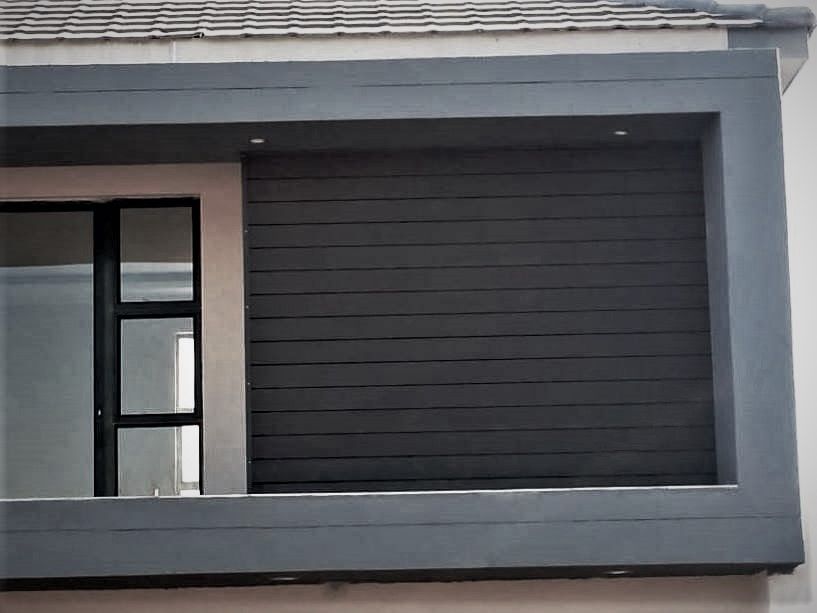 A building with a balcony on the side of it