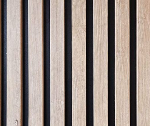 A close up of a wooden wall with black stripes.