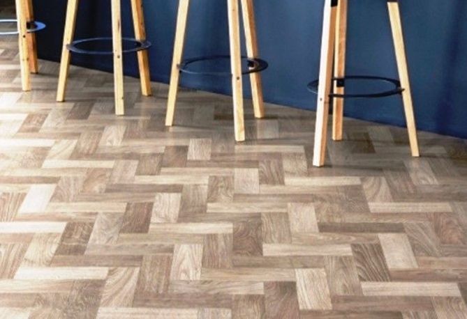 A row of bar stools sitting on a wooden floor