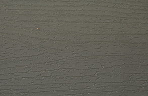 A close up of a gray surface with a grainy texture.