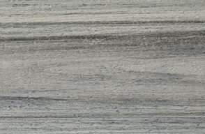 A close up of a gray marble tile with a striped pattern.