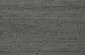 A close up of a gray concrete surface with a striped pattern.