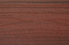 A close up of a piece of red wood.