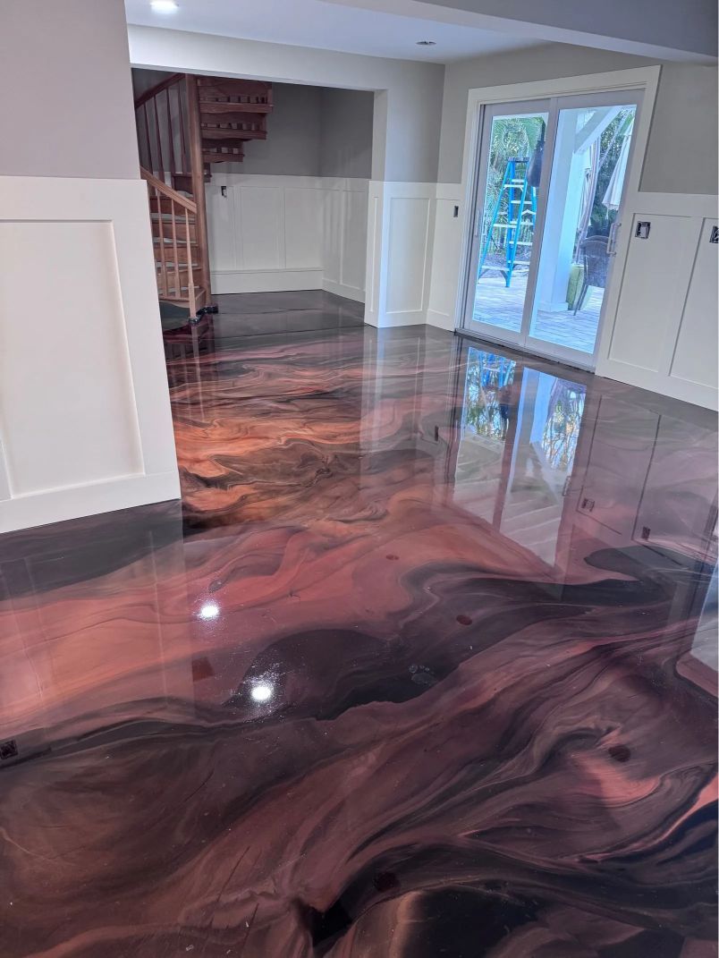Close-up view of a floor with colorful chips of red, green, black and white.