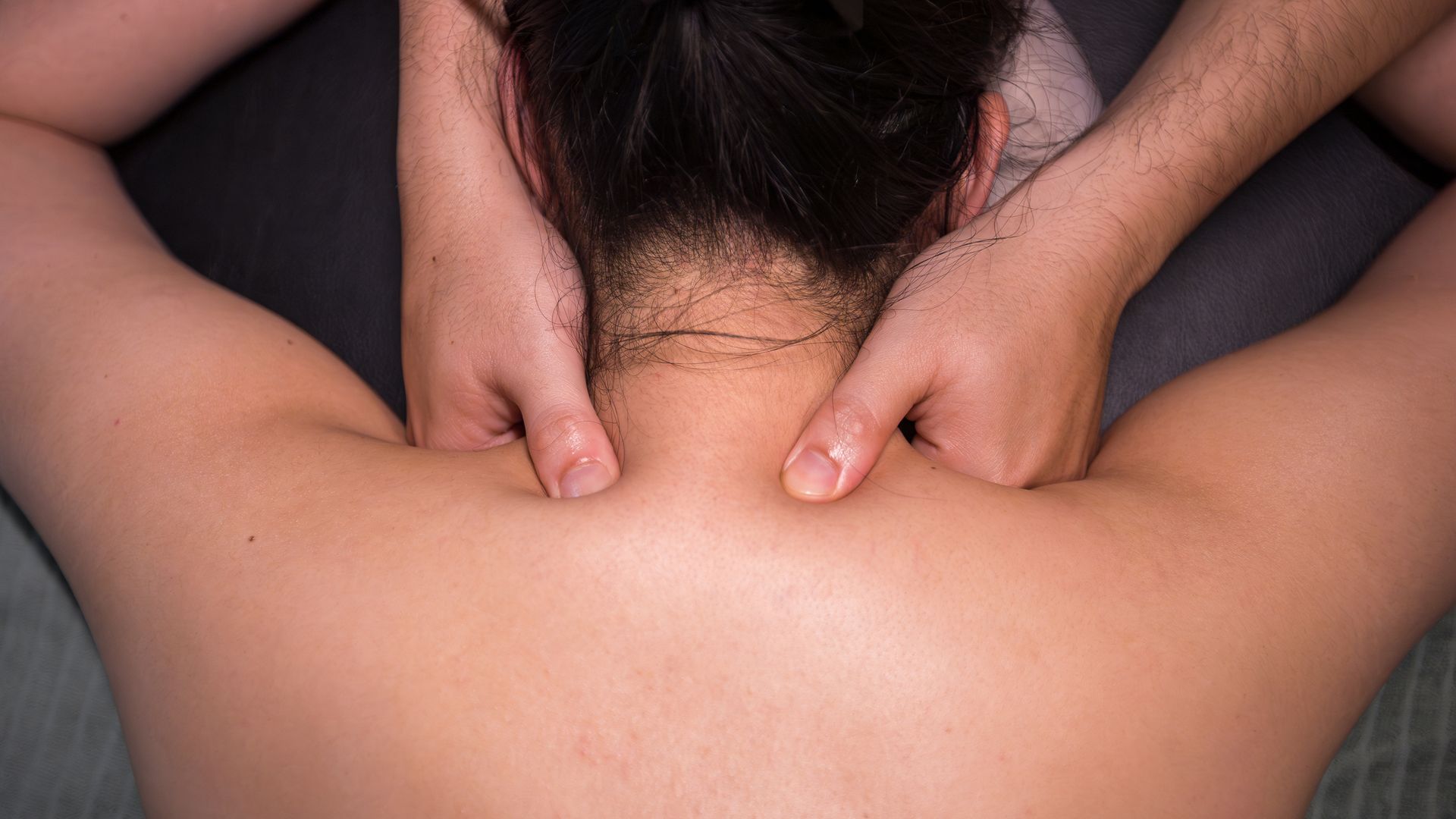 Person receiving a neck and shoulder massage - Thames, NZ - Thai Classic Massage Thames