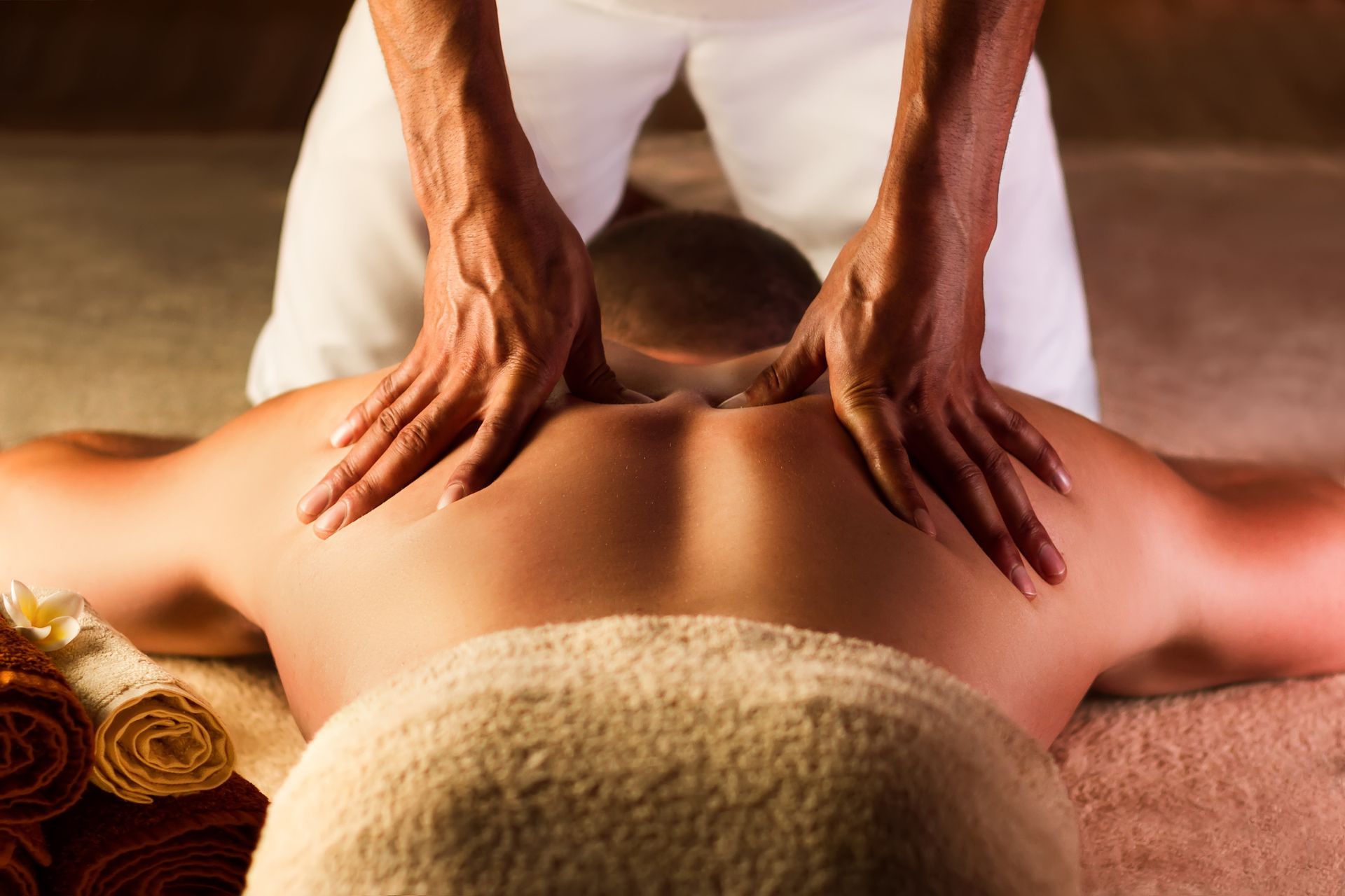 Person receiving a back massage with hands pressing down - Thames, NZ - Thai Classic Massage Thames