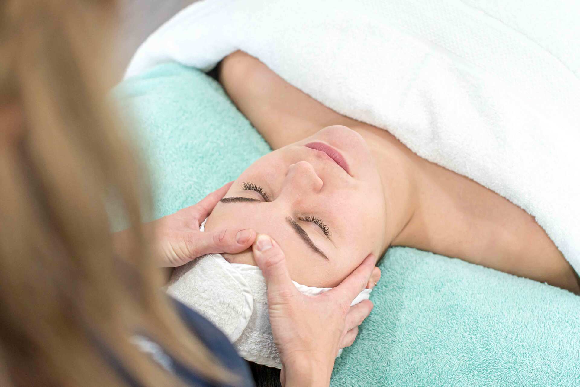 A Woman Having a Head Massage — Beauty Salon in Bundaberg, QLD