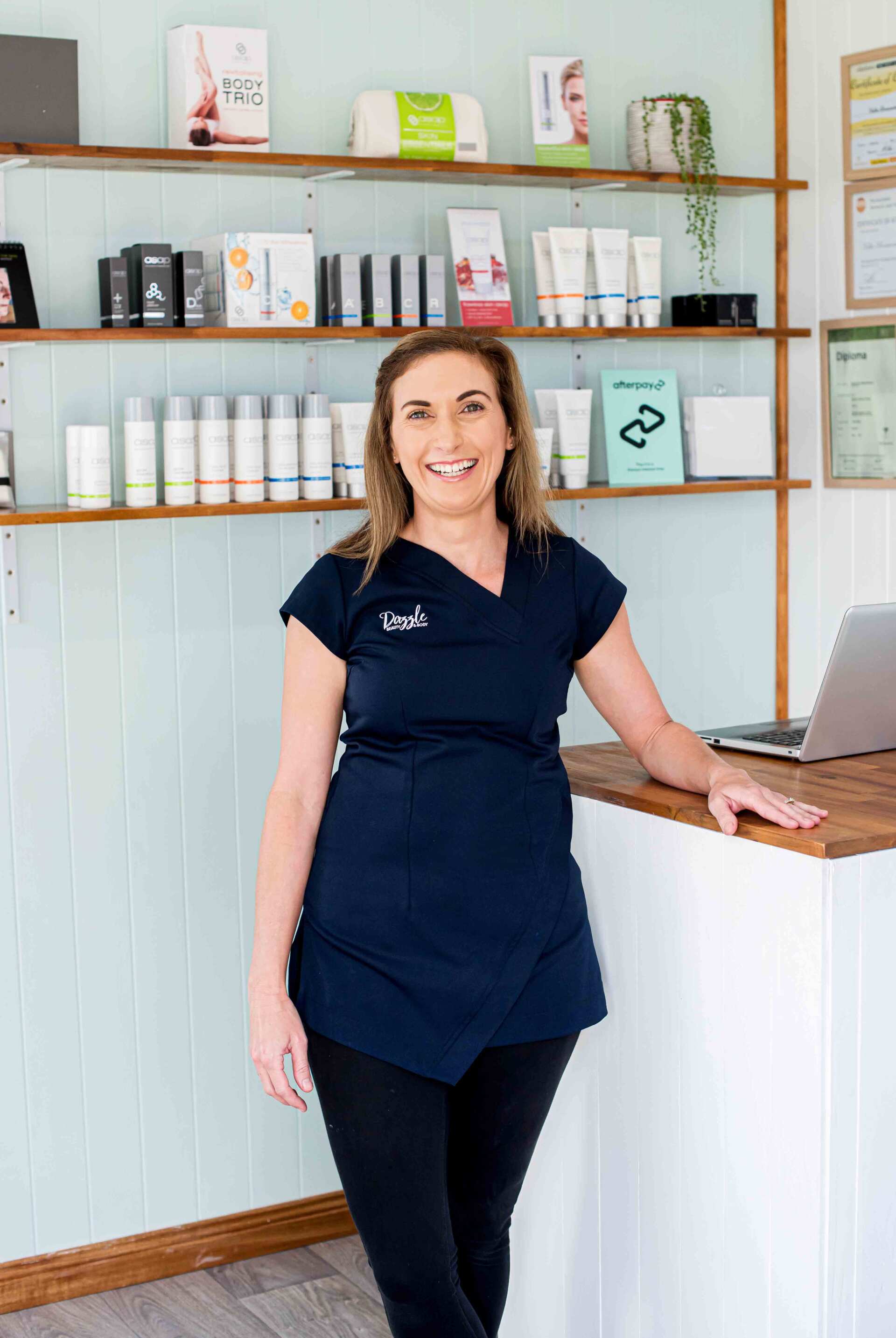 Beauty Therapist Standing in Reception Area — Beauty Salon in Bundaberg, QLD