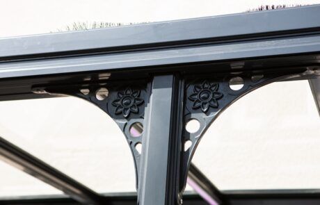A close up of a metal structure with a flower design on it.