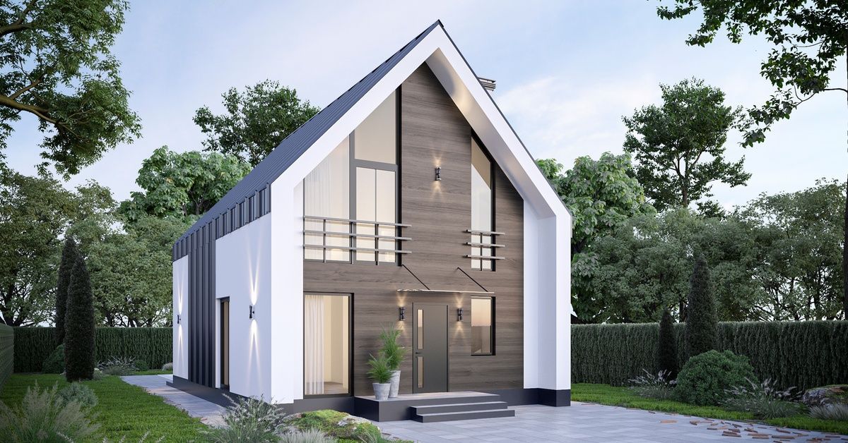 A brown, white, and gray paneled home with a barn-style build in a modernized design, in a yard with a tiled walk-up.