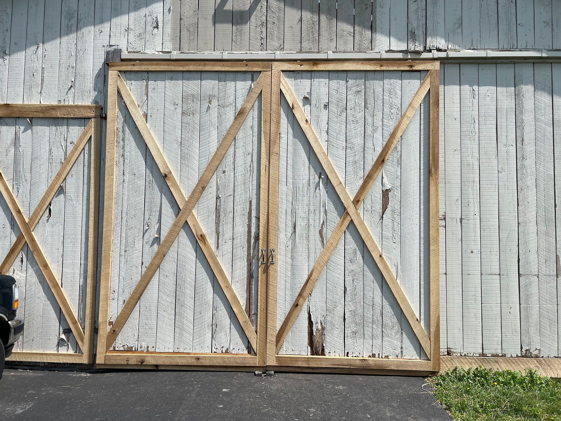 White barn doors with a light wood 