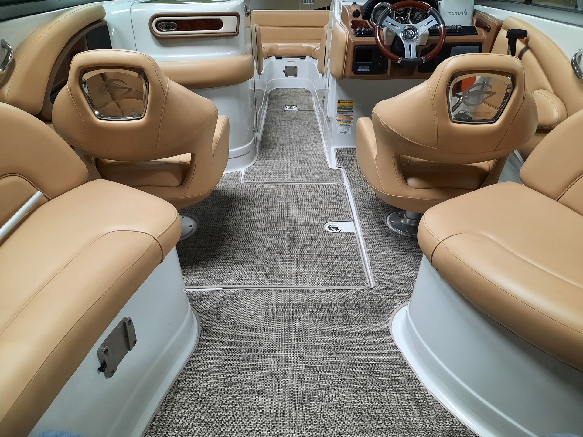 a boat with brown leather seats and a steering wheel