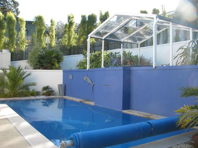blue swimming pool by blue wall
