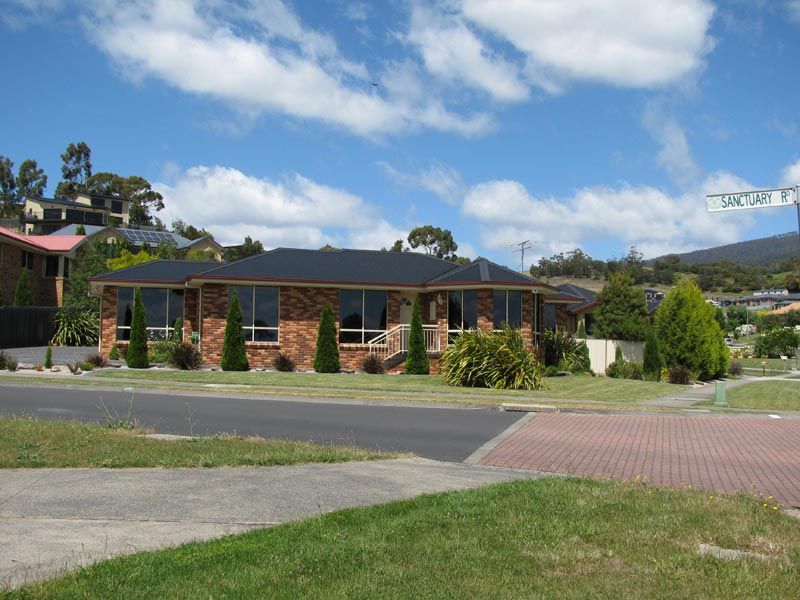 view of red brick home