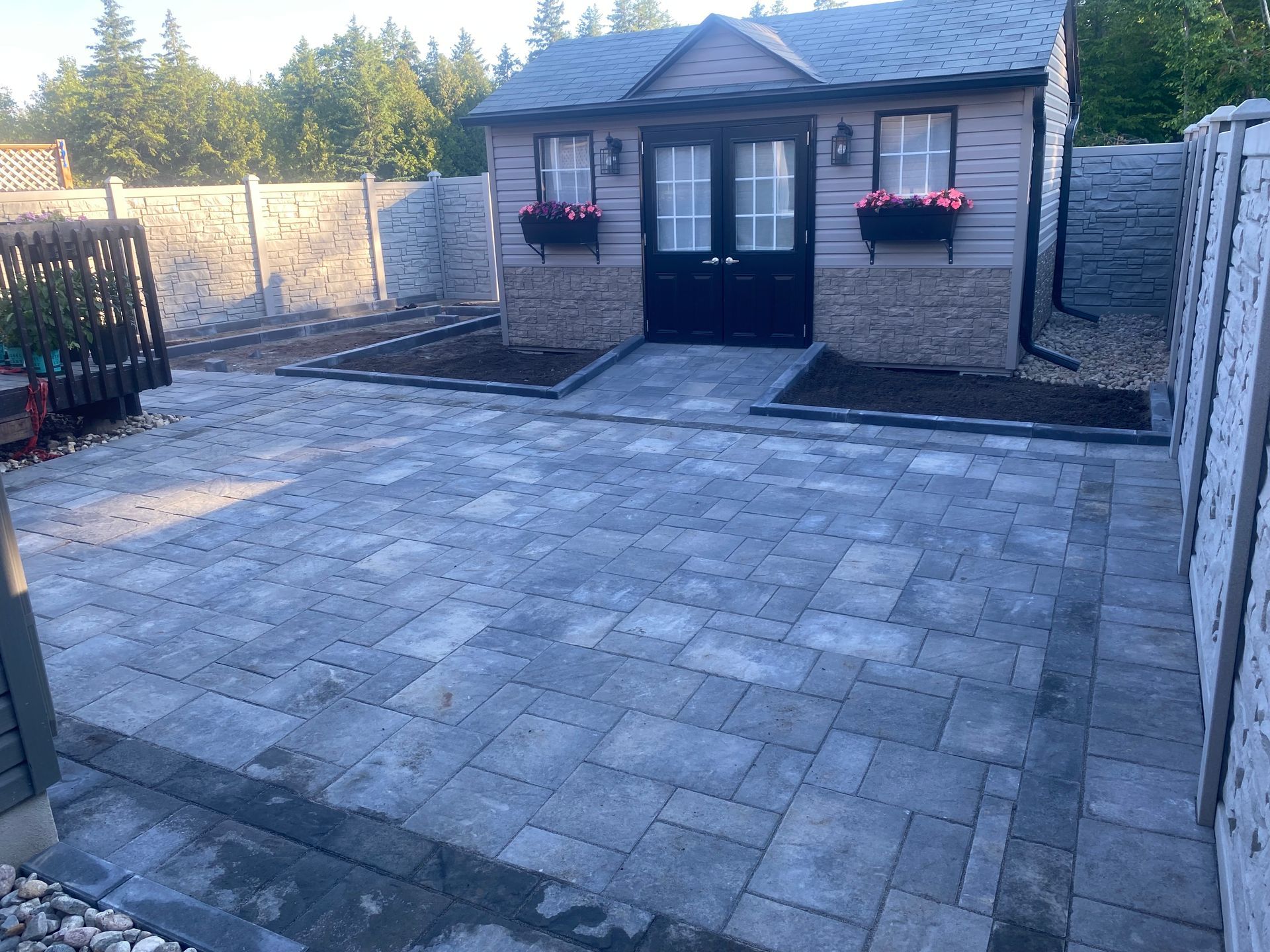 A small house with a patio in front of it