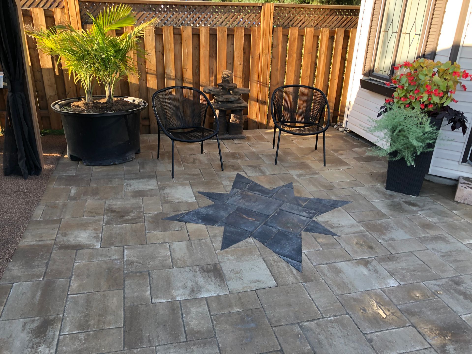 A patio with a star in the middle of it.